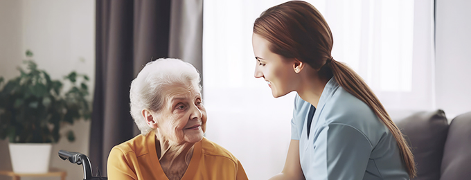 a female nurse giving respite care to an elderly lady